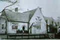 Some pupils outside the schoolhouse