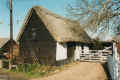 The cottage/barn by the church gate